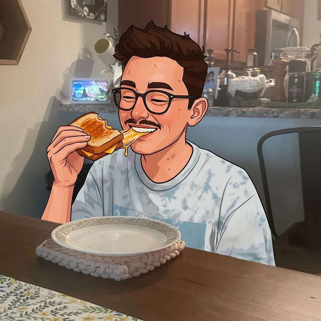 The same young person sitting at a kitchen table, eating the grilled cheese sandwich with the cheese being pulled.